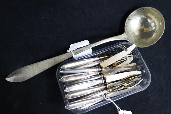 A silver 800 standard soup ladle (Austrian import mark) and ten pairs of silver-handled (800) fruit eaters (gilt loss to knife blades)